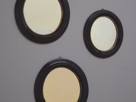 Trio of Ebonised Oval Mirrors Fashion